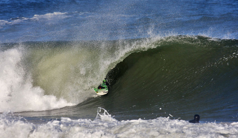 Brett Barley- Brett Barley\'s stomping grounds, the Hatteras Lighthouse, is  some thirty miles south of this spot in Rodanthe. But it\'s always a pleasure to see him doing his thing in the Mirlo Beach tubes.  Photo: Mickey McCarthy.