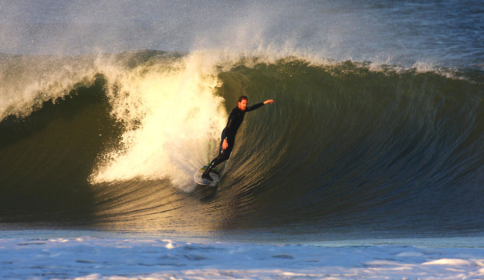 Jeff Myers- Standing tall on the late afternoon wall, Jeff Myers got the most out of what light we had left. The shadow in the whitewater in front of Jeff are actually the shadows from the houses on the beach slowly moving out into the lineup as the sun gets lower.  Photo: Mickey McCarthy.