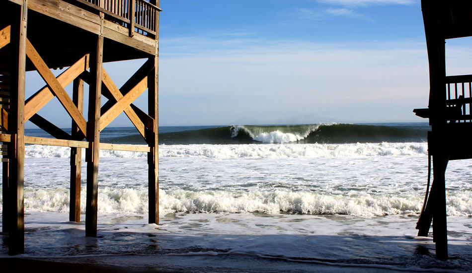 Mirlo Beach-There was a time when the beach behind these houses reached out to where that wave\'s breaking. This stretch of beach is actually the farthest point east on the Outer Banks and takes a steady hammering because of it. Mirlo Beach, Rodanthe Photo: Mickey McCarthy.