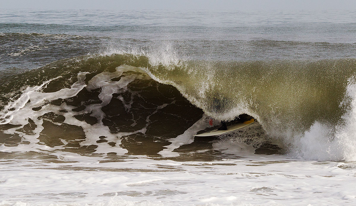 Noah Snyder in a solid shorebreak barrel. Photo: Bob Hovey