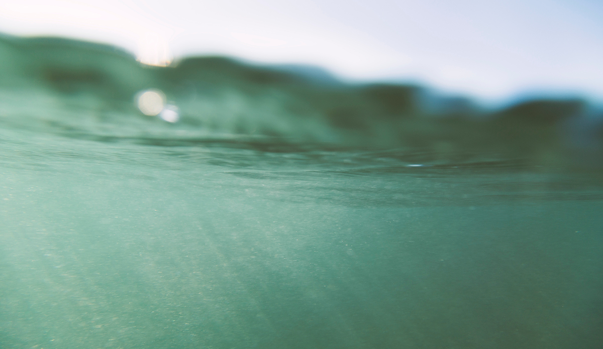 Catching rays of light in the vast body of water on a somewhat clear day. Black sand doesn’t allow much visibility  underwater. Photo: <a href=\"http://www.kheperphoto.com/\">Paola Núñez Linares</a>