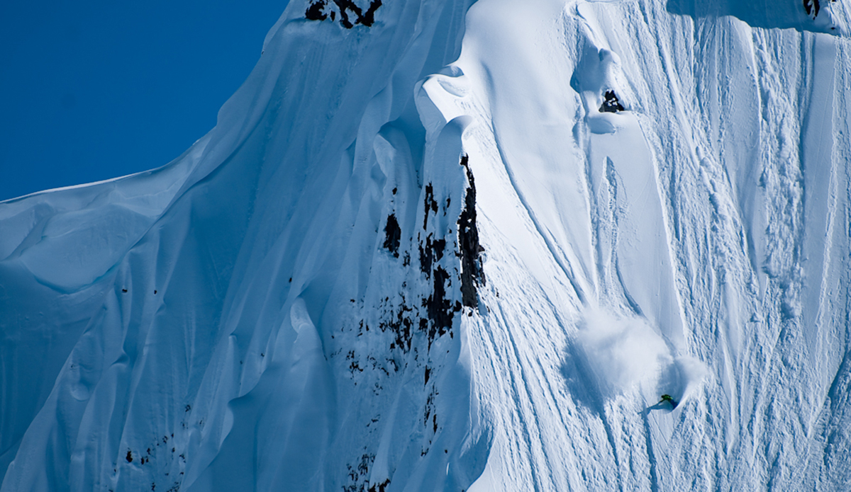 This guy is like our Gerry Lopez of snowboarding, but much younger. They are both legends but like the reverse of each other. Gerry surfs and shreds, but DCP (short for David Carrier-Porcheron) shreds and surfs. It’s different. This line is a 20 minute sled (we call snowmobiles sleds) ride from the trucks near Whistler. Photo: <a href=\"http://www.philtifo.com/\">Phil Tifo</a>