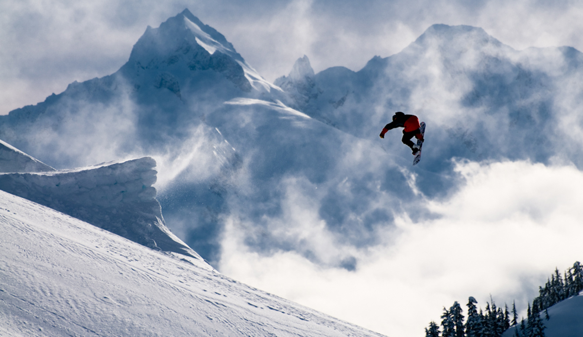 Logan short with a casual backside 180 in front of a really nice backdrop in Whistler. Photo: <a href=\"http://www.philtifo.com/\">Phil Tifo</a>