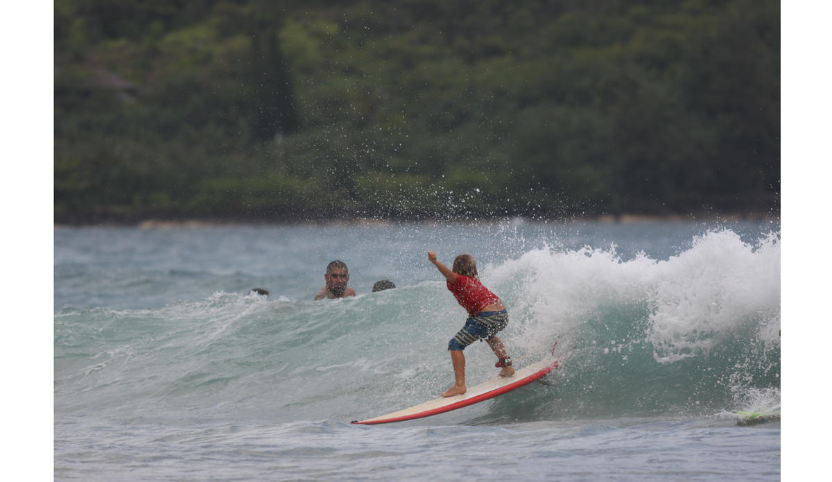 The keiki push in gets extreme. Dozens of groms hit the water. This little guy went big. Photo: <a href=\"http://www.danegrady.com/\">Dane Grady</a>