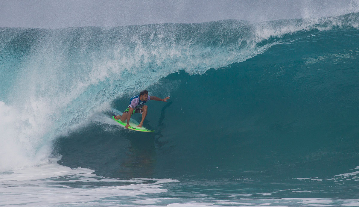 Michel Bourez of Tahiti (pictured) winning his Round 2 heat after snapping his surfboard during the Billabong Pipe Masters on Saturday December 13, 2014. In the challenging conditions Bourez defeated wildcard Makai McNamara (HAW) with a heat total of 8.33 points (out of a possible 20.00). Photo: <a href=\"http://www.aspworldtour.com/\">ASP</a>/Masurel