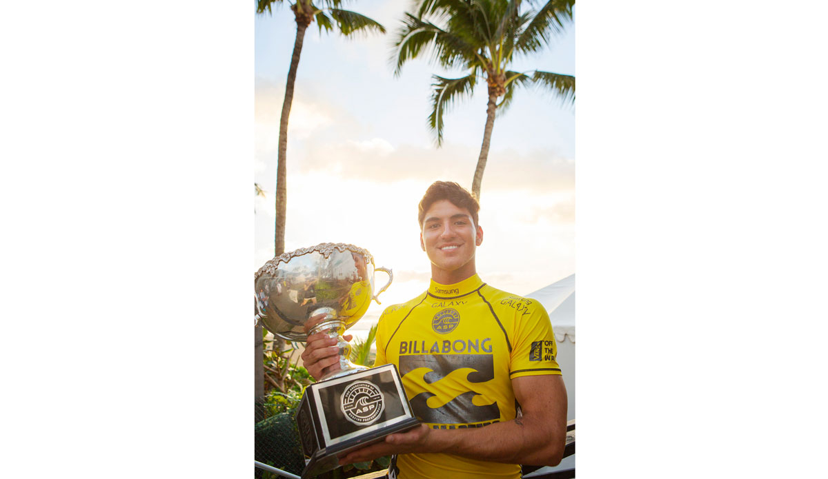 Gabriel Medina of Brasil (pictured) holds his ASP World Title trophy after winning his innuagural ASP World Title when his closest rival Mick Fanning (AUS) was eliminated in Round 5.  Photo: <a href=\"http://www.aspworldtour.com/\">ASP/</a> <a href=\"http://www.kirstinscholtz.com/\">Kirstin Scholtz</a>