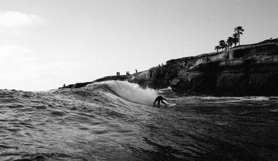 Cris Loomis is one of the best surfers to come out of the Sunset Cliffs area. The guy has epic style and gets barreled literally every session, even when the waves aren\'t barreling. He\'ll go down as a legend for sure. Here he is on a 5\' 9\" Garrett Goodwin shape. Nikonos v, kodak tmax 3200 film. Photo: <a href=\"http://fotoburns.com\">Adam Burns</a>