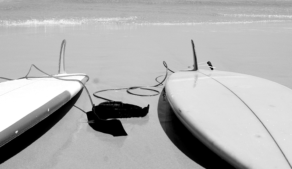 Classic single fin surfboards lined the beach. © Jared Aufrichtig