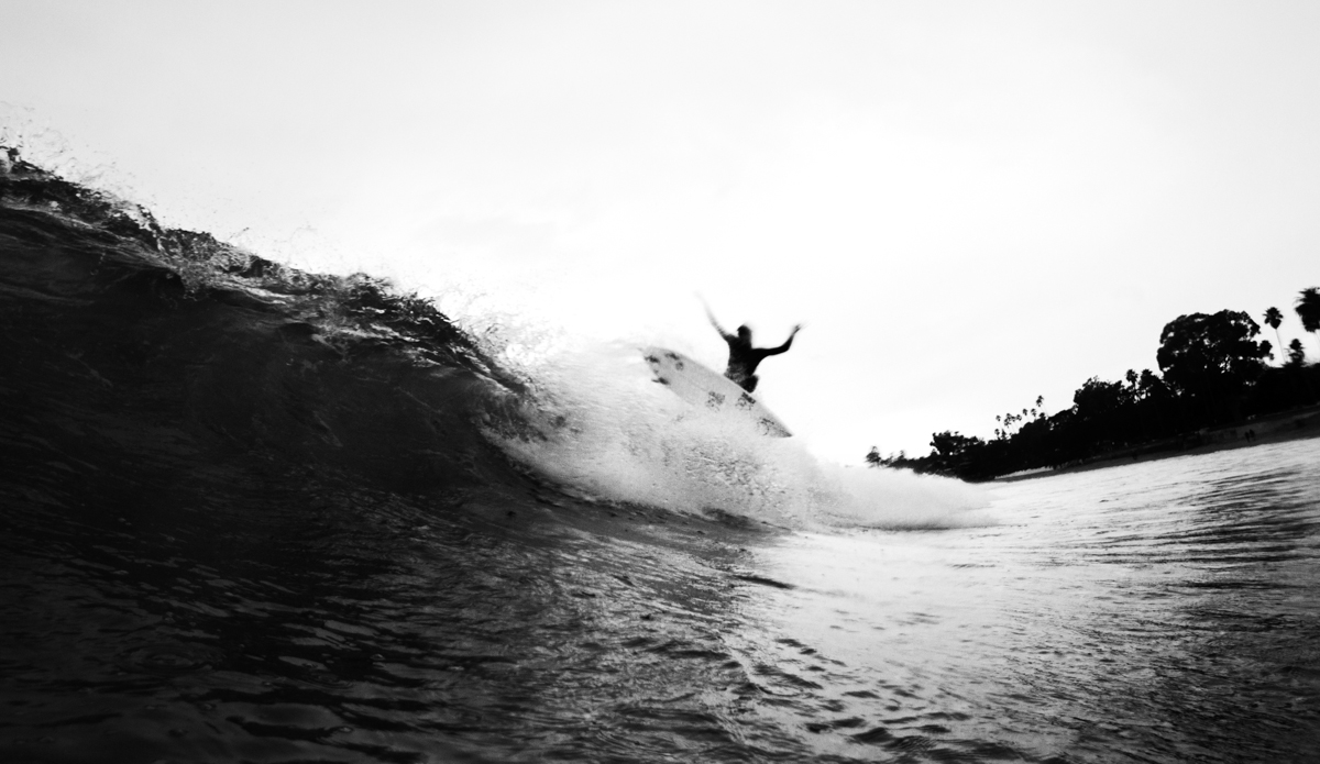 Los Angeles surfer Matt Hoffman showing his teeth on a gray day in Santa Barbara, California. Photo: <a href=\"http://www.maxxbuchanan.com/\">Maxx Buchanan</a>