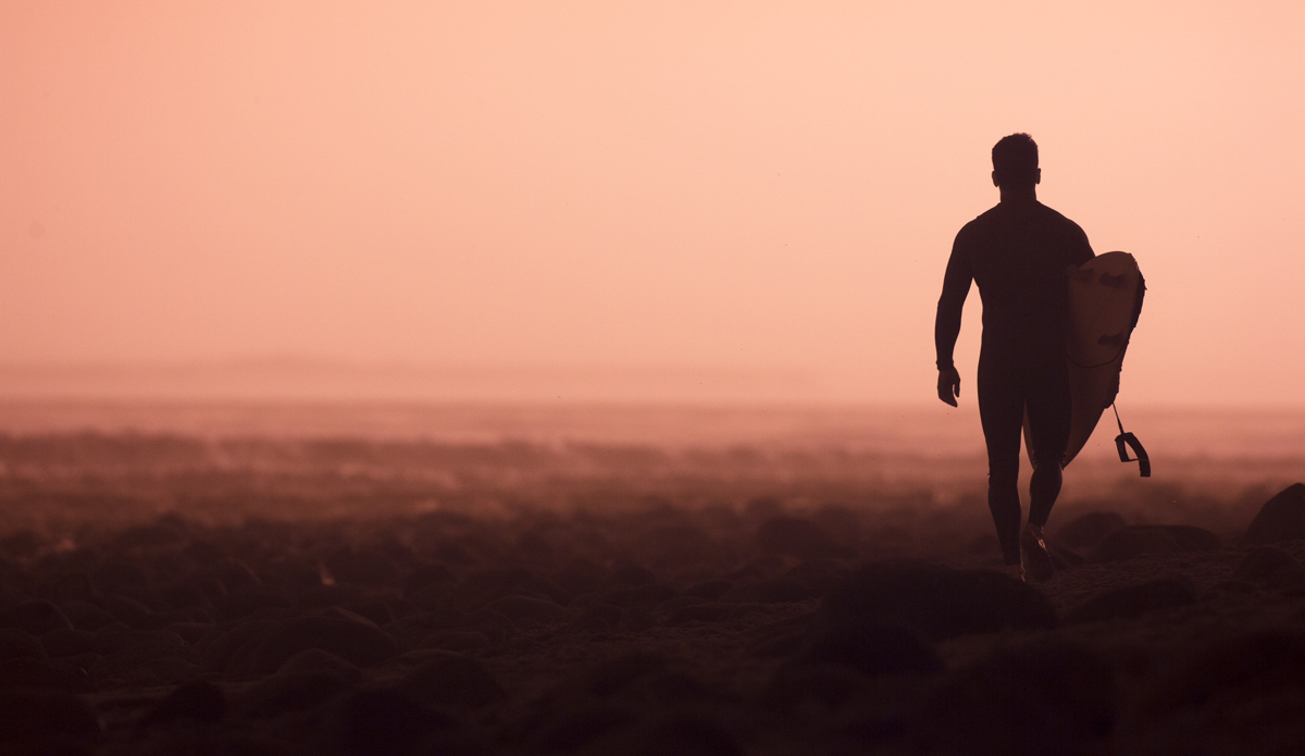 An unknown surfer forever silhouetted against a winter sunset at Rincon. Photo: <a href=\"http://www.maxxbuchanan.com/\">Maxx Buchanan</a>