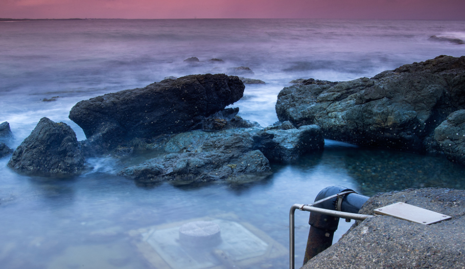 The pool at Blackhead beach is surrounded by beautiful rockpools, and then there\'s a pump right in the middle of it all. Photo: <a href=\"http://www.twhyphotography.com\">Tyhe Reading</a>