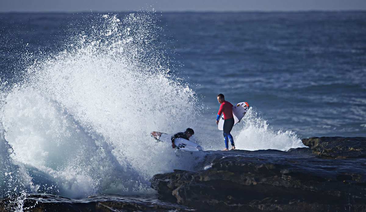 Bruce Irons (L) and Koby Abberton (R) chased out by the whitewash. Photo: <a href=\"http://www.redbullsignatureseries.com/cape-fear-2014\">Red Bull</a>