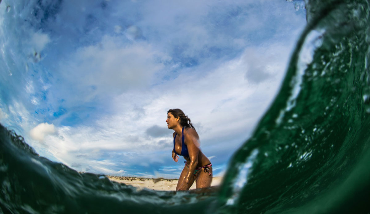  An incredible single frame shot. The water has already begun to wrap around the housing allowing you to see the back on the wave on the right, while the front of the dome was still sticking through the wave, allowing a crystal clear view of the surfer Anna Anderson. Photo: <a href=\"https://richbrooksphotography.squarespace.com/\"> Rich Brooks</a>