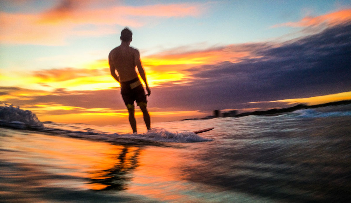 Scott Rumley taking a moment to take in a beautiful blend of colors from this Florida sunset. Photo: <a href=\"https://richbrooksphotography.squarespace.com/\"> Rich Brooks</a>