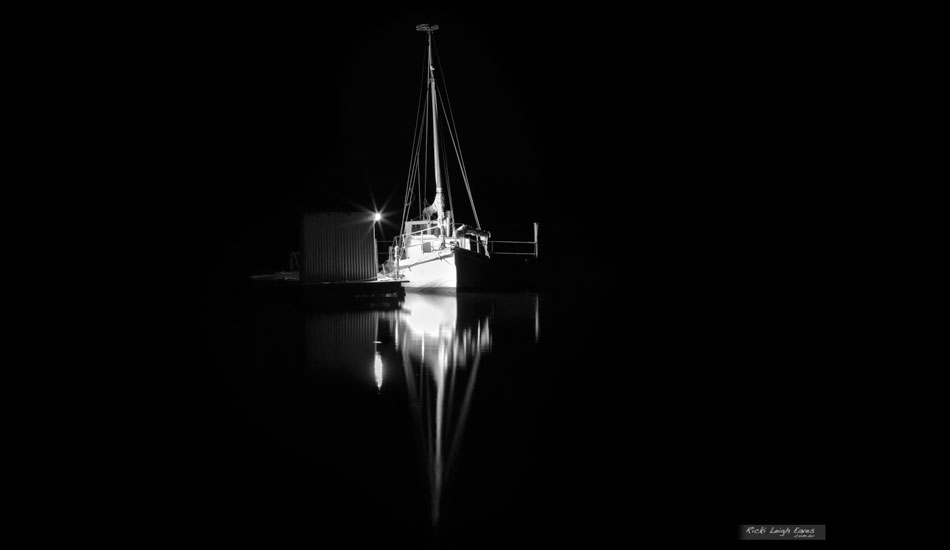 Just before this the beach was deserted and I out shooting the stars, then this fisherman showed up and lit up his boat from his cleaning shed, Boomer Bay, Tasmania. Photo:<a href=\"http://www.rickileigheaves.com.au\"> Ricki Eaves<a/>