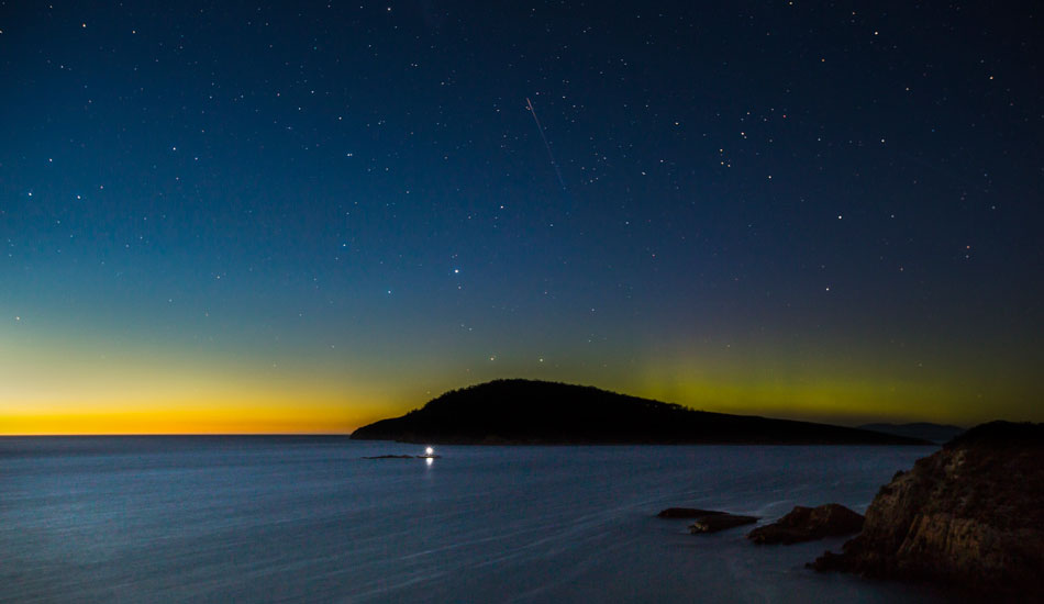 A very rare sight with a strong Aurora display lasting through the sunrise featuring Betsy Island, South Arm Peninsula, Tasmania. Photo:<a href=\"http://www.rickileigheaves.com.au\"> Ricki Eaves<a/>