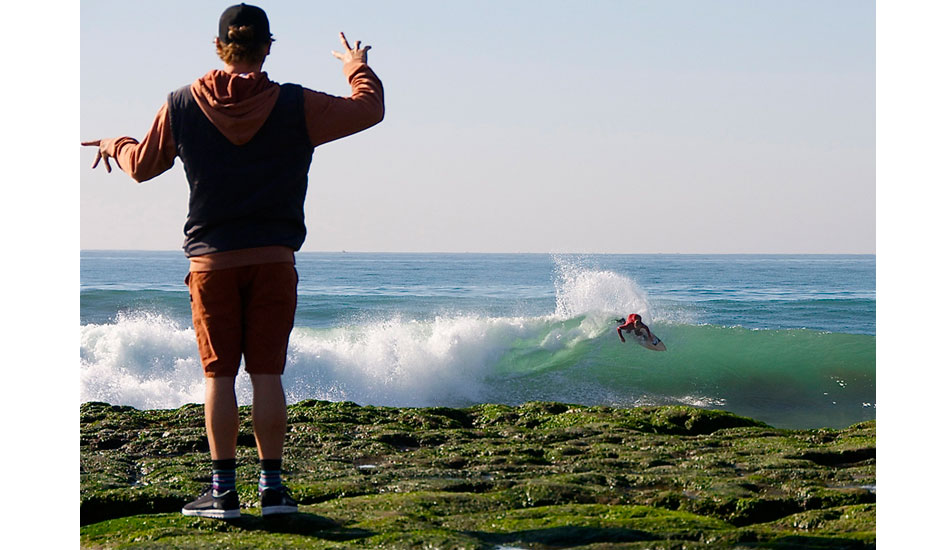 Matt Meyers finger surfing while Buddy Frietas dose the real thing. Photo: Robb Wilson