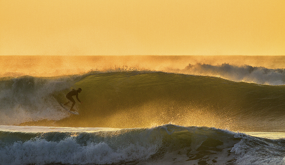 Shaper Felix Dickson test driving his own shapes in the Cornish evening gold. Photo: <a href=\"http://surfphoto.500px.com/home\"> Roger Sharp</a>