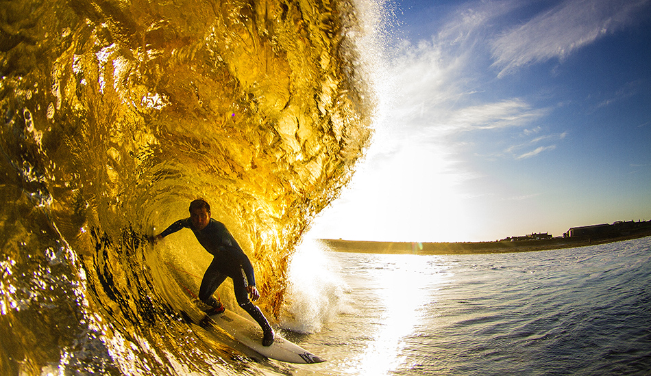 Peat particles in the water make for beer coloured barrels for Micah Lester at Thurso. Photo: <a href=\"http://surfphoto.500px.com/home\"> Roger Sharp</a>