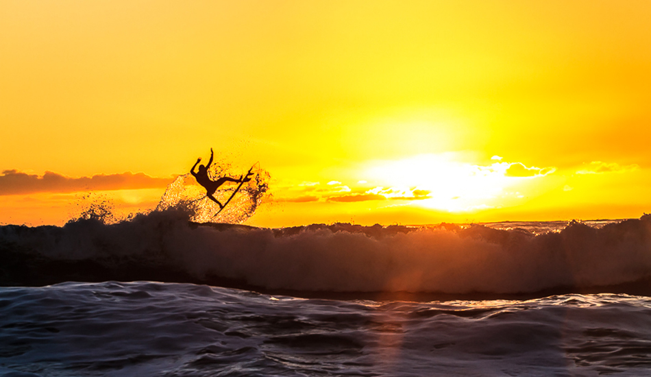 Tristan Sullaway taking flight at sunset. Photo: <a href=\"http://www.surfingeye.com/\" target=_blank>Ronald Hons</a>.