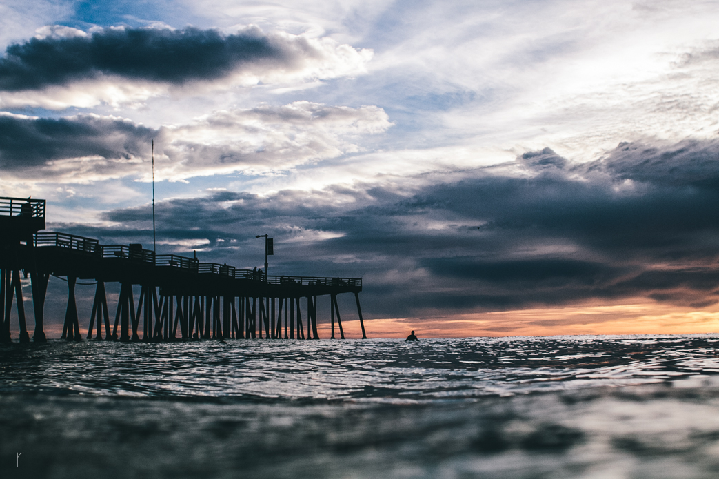 Lone surfer soaking in the view. Photo: <a href=\"www.russellholliday.com\">Russell Holliday</a>