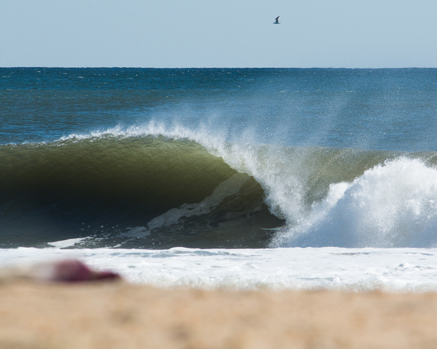 Mike looks toward the water on his way to paddle back out again, admiring the barrels he has been cruising through all morning. Photos: <a href=\"http://instagram.com/halbe_\">Ryan Halbe</a>