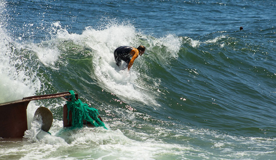 Clay Pollioni surfing the shipwreck. Photo:<a href=\"http://ryanmackphoto.blogspot.com/\" target=_blank>Ryan Mack</a>.