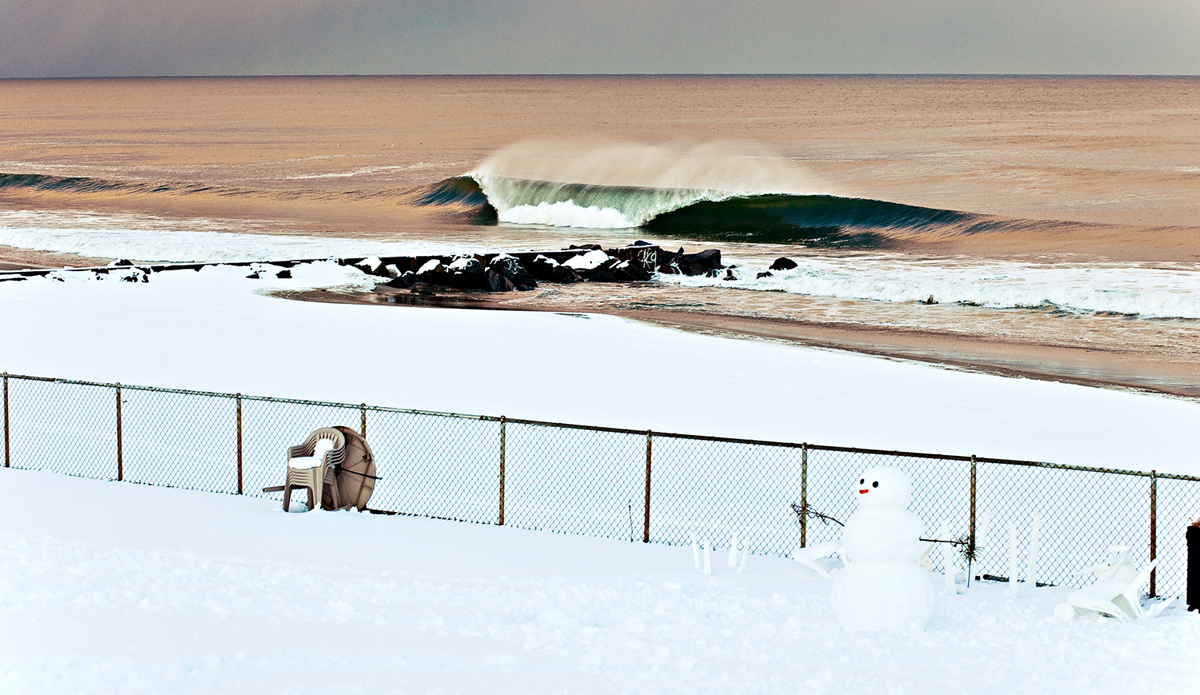 A cold winter day just after a passing snow storm laid a pile of fresh snow and brought plenty of waves to New Jersey. I was shooting water this day and came away with a few good images but I knew I had to get out and get the land angle with the snowman. I saw a child making it as we paddled out. This is one of my best selling prints and you can purchase it <a href=\"http://greatbreaks.surfline.com/collections/all/products/frosty-the-stoke-man\">here</a>. Photo: <a href=\"http://www.ryanstruck.com/\"> Ryan Struck</a>