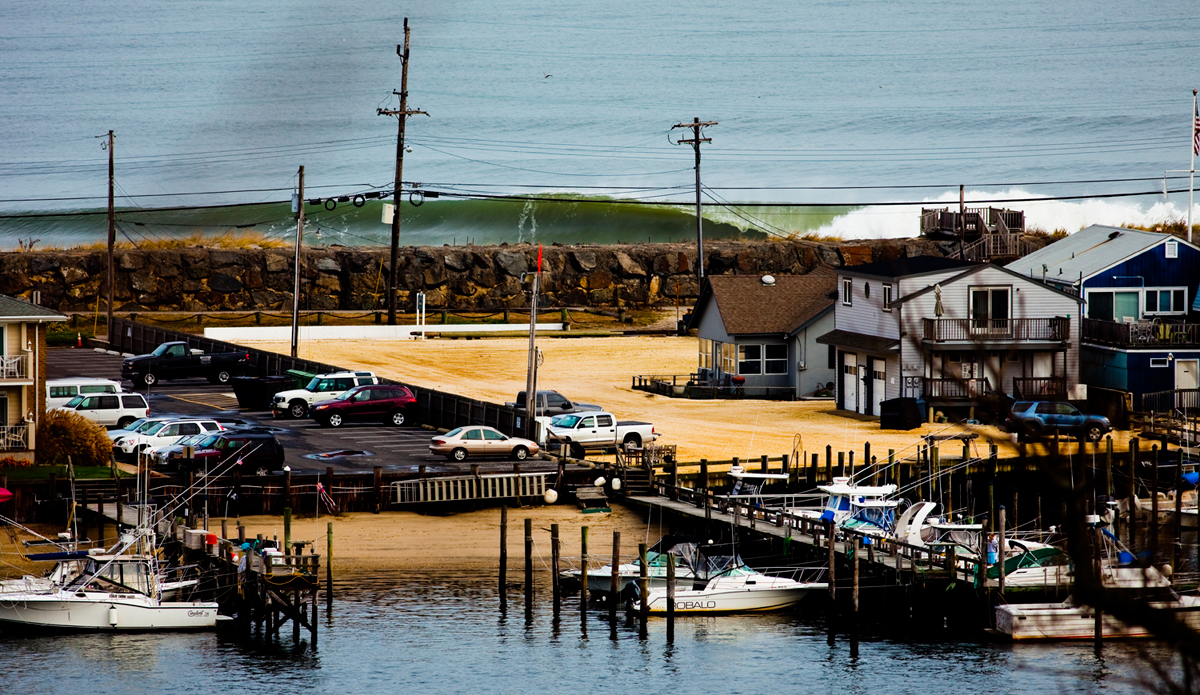 I love this angle. I have a penchant for shooting from above, but a bank account that doesn\'t allow that luxury. This is the poor man\'s aerial surf photo that I photographed during Nor\'Ida. I\'ve been up here to get this view a few years now but it doesn\'t always work. It looks best with a huge swell and sunlight, that\'s a rare combo in Jersey. Shooting on a mushy, grey day just isn\'t worth exposing the break. This photo is hanging on the wall at Woody\'s in Sea Bright, nice and big. Thanks Woody! Photo: <a href=\"http://www.ryanstruck.com/\"> Ryan Struck</a>