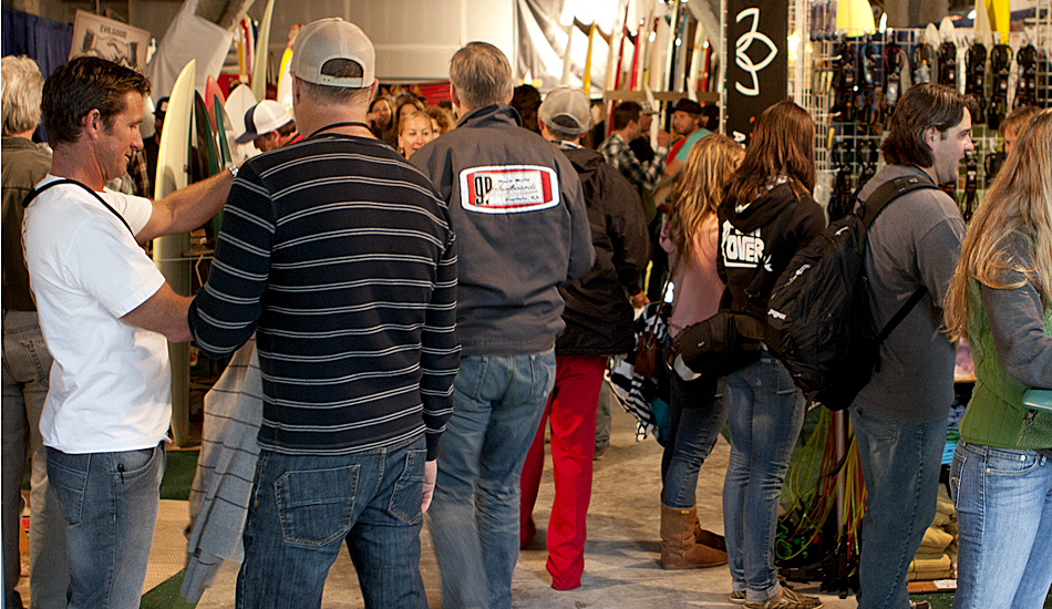 Regular surfers and surfing icons alike flocked to Sacred Craft to
check out the boards, the equipment, new technology and live shaping.
Robert \"Wingnut\" Weaver (white t-shirt, far left) of Endless Summer II
fame was among the 3,200 in attendance. Photo: Maggie Yount