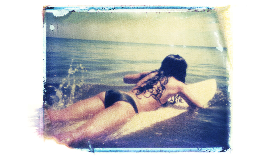 Surfer girl. A beautiful girl, a perfect splash, and perfect edge on the Polaroid. Image: <a href=\"http://shehitpausestudios.com/\" target=\"_blank\">Schwartz</a>