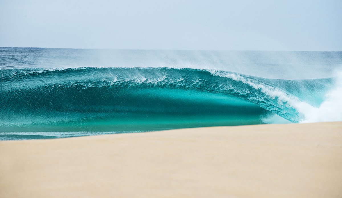 A rare north swell from a cyclone earlier in 2018, I’d just had shoulder surgery after a mountain bike stack. I couldn’t swim water and could barely lift my camera but I wasn’t going to miss it. This was a sneaky one down the line that I don’t think anyone shot. Love the emerald glow in this one. 
Photo: Scott Bauer // @scottbauerphoto