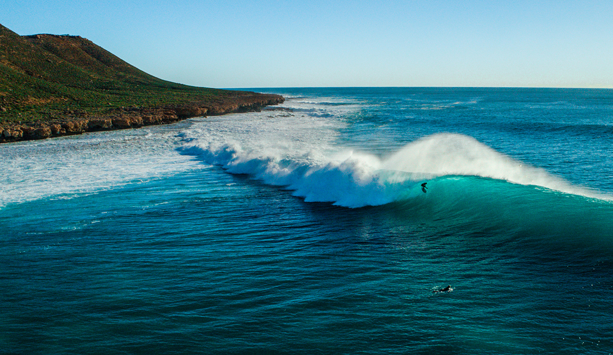 Lockie Caldwell (@doowekans) in the West Oz desert. Camping in the desert isn’t everyone’s thing and you have to pay your dues. It’s windy, dry, dusty, there are heaps of flies, sea urchins, and when it finally rains it usually pours. But when you score it’s magic. 
Photo: Scott Bauer // @scottbauerphoto