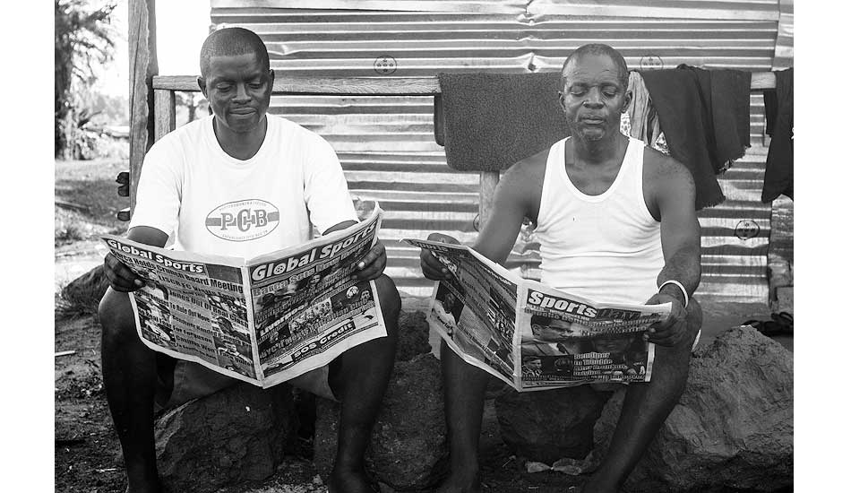 The love of sports is universal; Foster and Williams catching up on the latest. Photo: Sean Brody