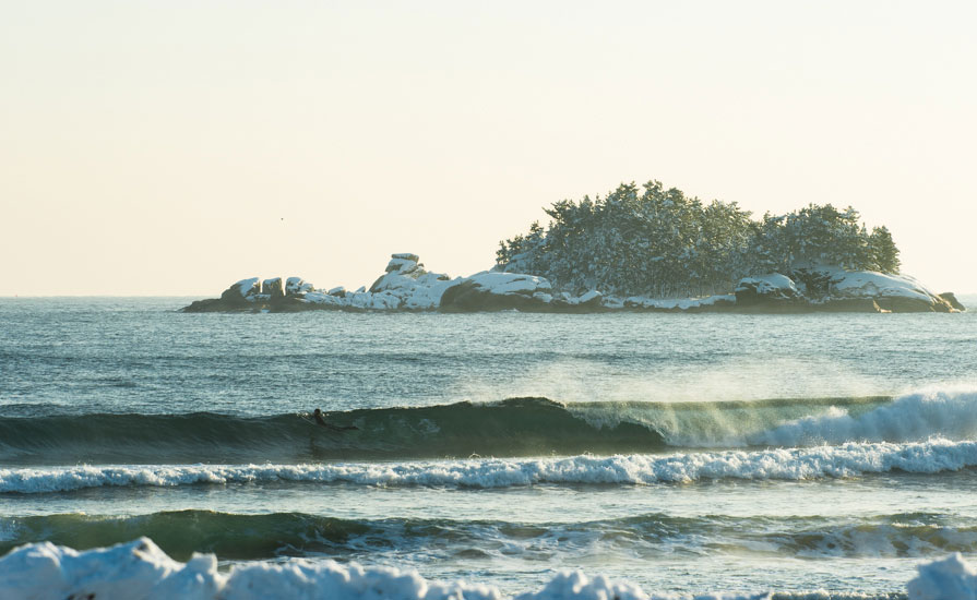 Korean surfer, Young-ik Son, looks for an early wave the day after the January snowfall. Jo-do Island is covered in snow. Photo: <a href=\"http://www.shannonaston.com/\" target=_blank>Shannon Aston</a>.