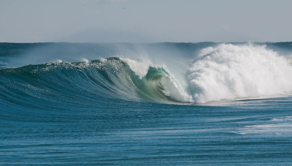 A simple wave, yes, but a beautiful, green-blue wave peeling through South Korea near the hostile DMZ shows us that anywhere can fire on it\'s day. On this day, it was South Korea! Photo: <a href=\"http://www.shannonaston.com/\" target=_blank>Shannon Aston</a>.