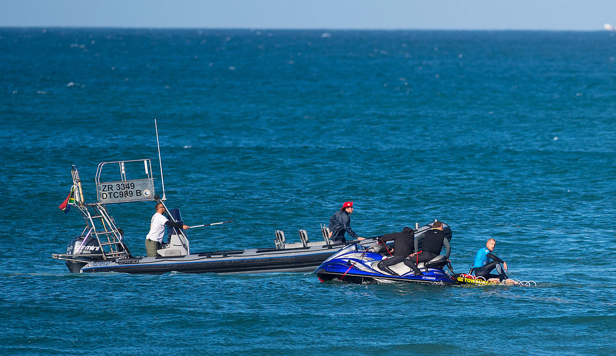 Mick Fanning of Australia (pictured blue) takes in the gravity of the situation from the safety of the jet ski as the water safety team continue to look for the shark that attacked Fanning during the final of the JBay Open on Sunday July 19, 2015.  Photo: <a href=\"http://www.worldsurfleague.com/\">WSL</a>/<a href=\"http://www.instagram.com/kirstinscholtz\">Kirstin Scholtz</a>