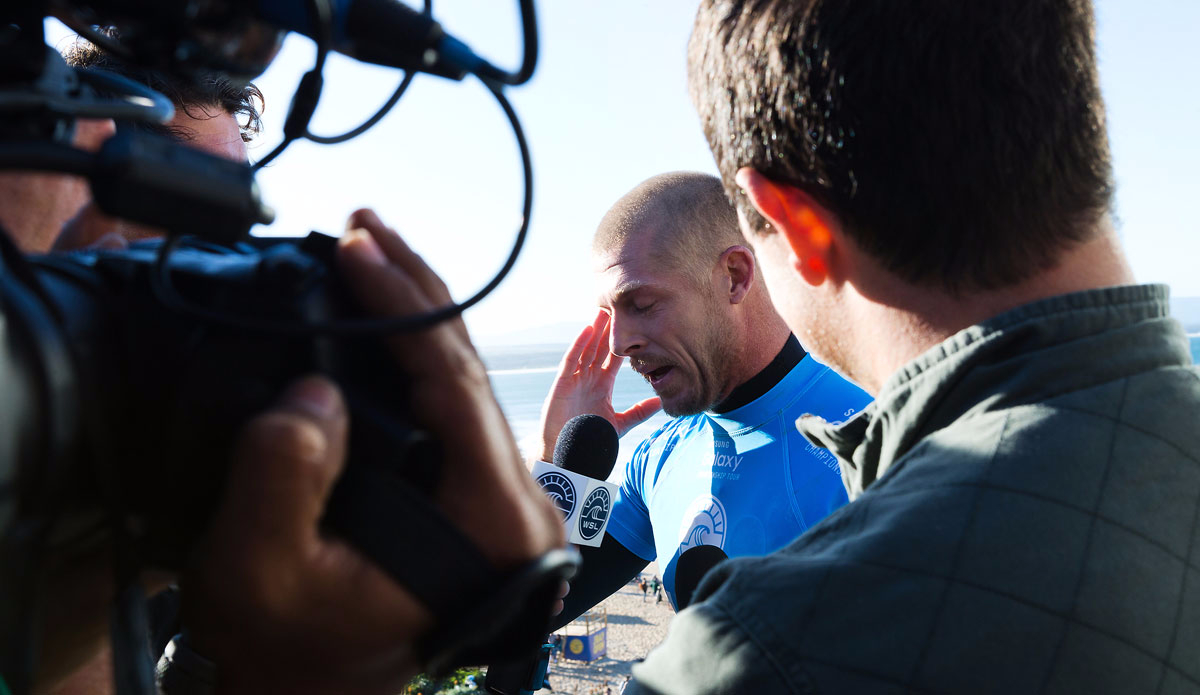 Mick Fanning of Australia (pictured blue) emotionally explains what he went through while being attacked by a shark during the Final of the JBay Open on Sunday July 19, 2015. Photo: <a />WSL</a>/<a href=\"http://www.instagram.com/kc80\">Cestari</a>