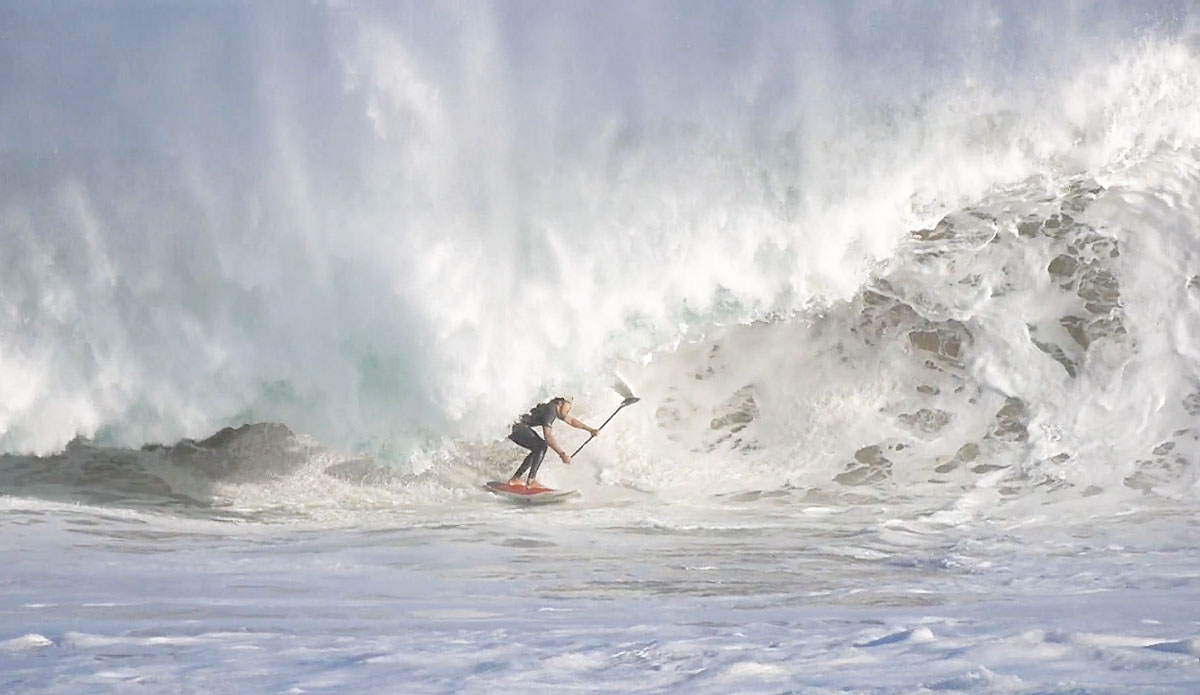 This dude is holding a paddle. And driving into a large, foamy close-out with it. 