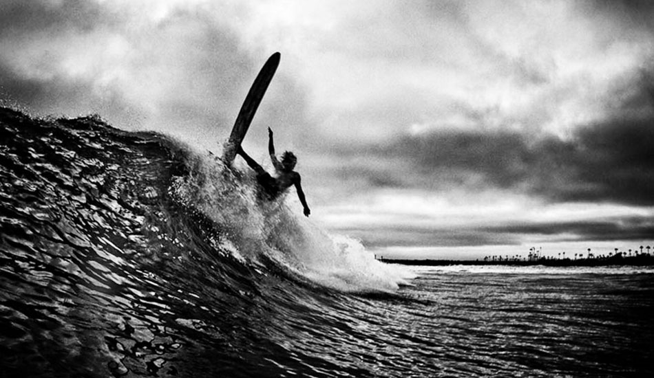 Travis Karian in Oceanside.  This guy rips longboards like they are 5\' shortboards.  This was also about 10 minutes before we got rained out.  (Slide film scan) Photo: <a href=\"http://www.jefffarsaiphotography.com/\">Jeff Farsai</a>