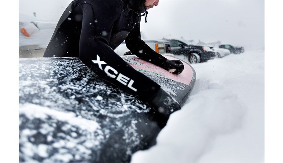 Mike Moran waxing up...and defining \"cold water\" surf wax. Photo: <a href=\"http://www.briannevins.com/\" target=_blank>Brian Nevins</a>