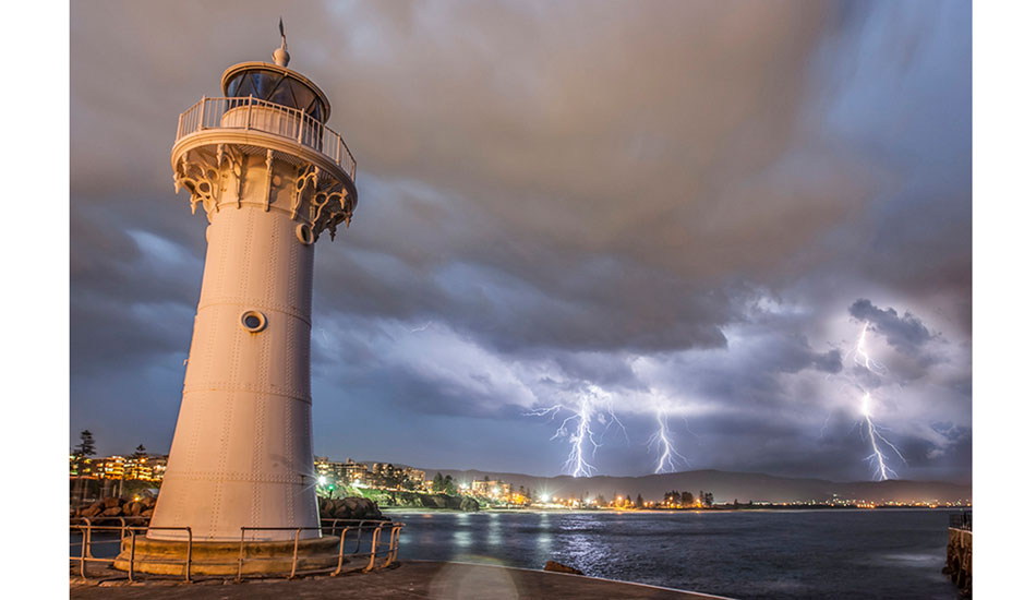 Wollongong’s Historical Lighthouse and a summer storm approaching. Photo: <a href=\"http://www.16images.com.au\">Steen Barnes</a>