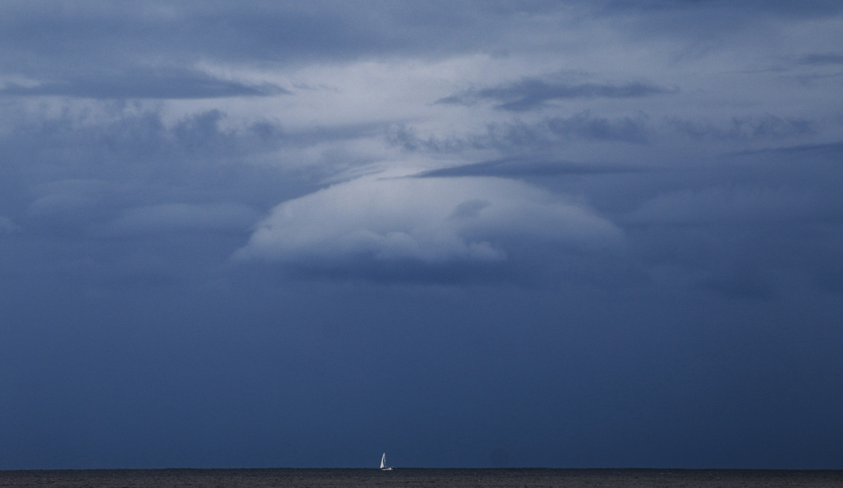 Isolation. I love using negative space to isolate a particular subject. This boat centered itself nicely underneath a heavy cloud out to sea. Photo: <a href=\"http://rickycavarra.com\">Ricky Cavarra</a>