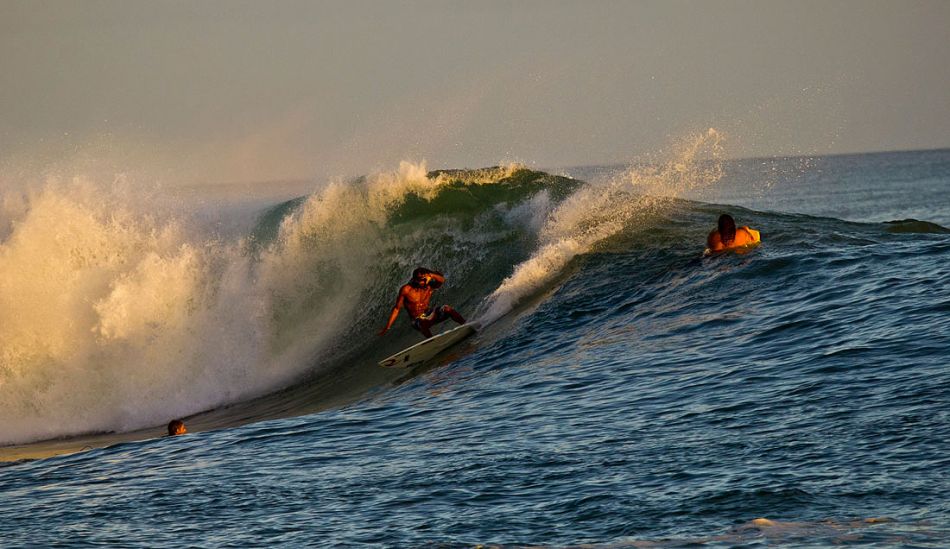 Baldwin wetting the rail and the bystander on the shoulder. Photo: Phil LeRoy