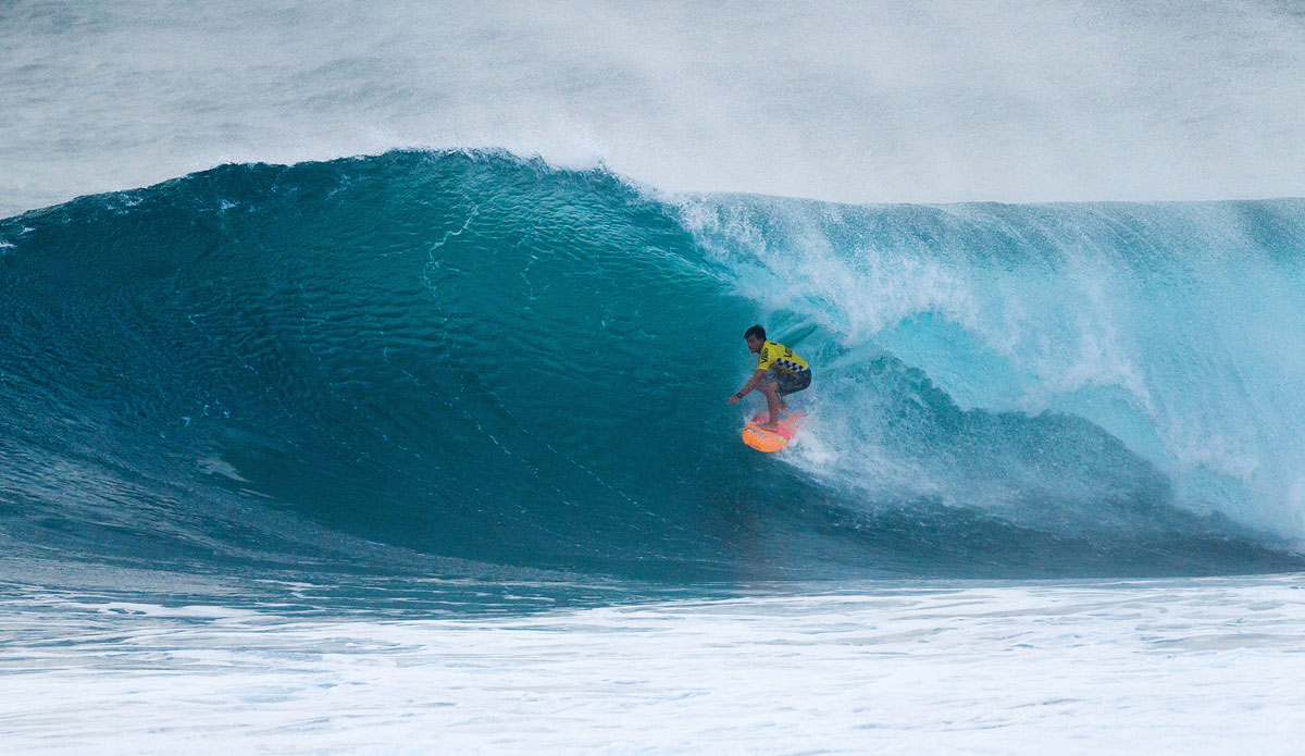 Keanu Asing of Oahu, HAwaii surfing inside a barrel during Round 3 on Wednesday December 3, 2014. Asing placed first advancing into Round 4. Photo:<a href=\"http://www.aspworldtour.com/\">ASP</a>/Cestari 