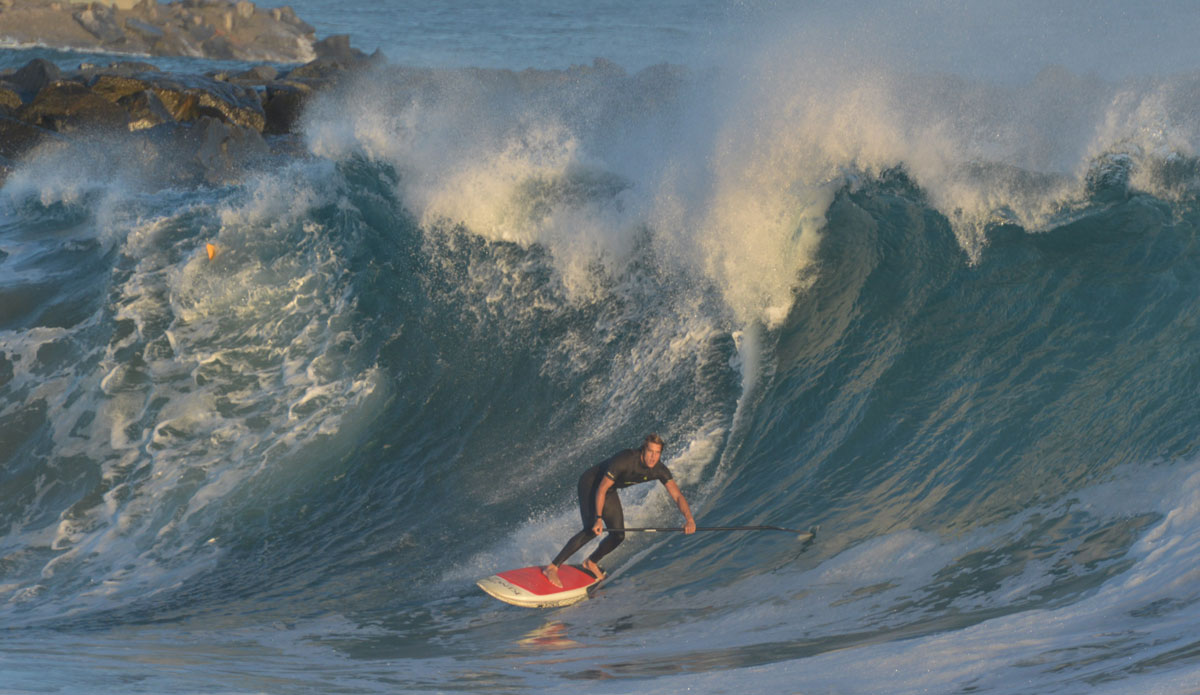 Daniel Hughes. Unfortunately, this wave ended up splitting the SUP in two. Photo: <a href=\"http://www.tylerbrundage.com/\">Tyler Brundage</a>