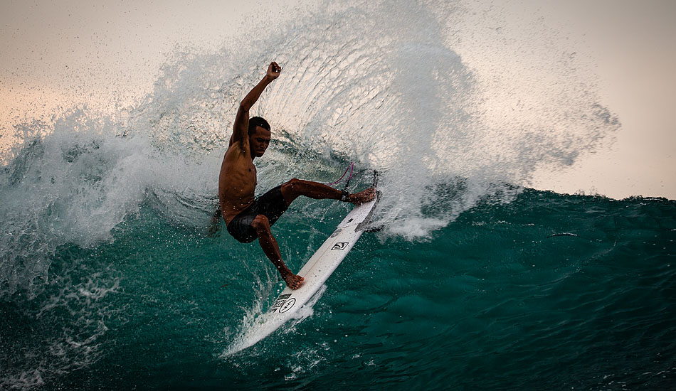 They say that traditional dancing has influenced the style of the Balinese surfers. Unfortunately that doesn\'t explain where Mega Semadhi got his break dancing skeels. Photo: <a href= \"http://tommyschultz.com/blog/category/photo-galleries/surf-photography-2/\">Tommy Schultz</a>