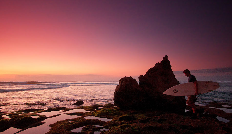 Most visitors to Bali watch the Uluwatu sunset from the top of the temple\'s cliffs while mischievous monkeys snatch their designer sunglasses and hold them for ransom in exchange for a handfull of peanuts. Far better to take a walk at low tide around Suluban Beach and catch the last light fading below the Indian Ocean horizon reflected in the glassy tide pools. Photo: <a href= \"http://tommyschultz.com/blog/category/photo-galleries/surf-photography-2/\">Tommy Schultz</a>