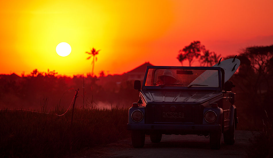 The VW bus may be the iconic surf mobile in California, but the VW \'Thing\' takes the prize in Indonesia. Bali longboarder Anders takes a shortcut through some Canggu rice terraces to catch a sunset wave. Photo: <a href= \"http://tommyschultz.com/blog/category/photo-galleries/surf-photography-2/\">Tommy Schultz</a>