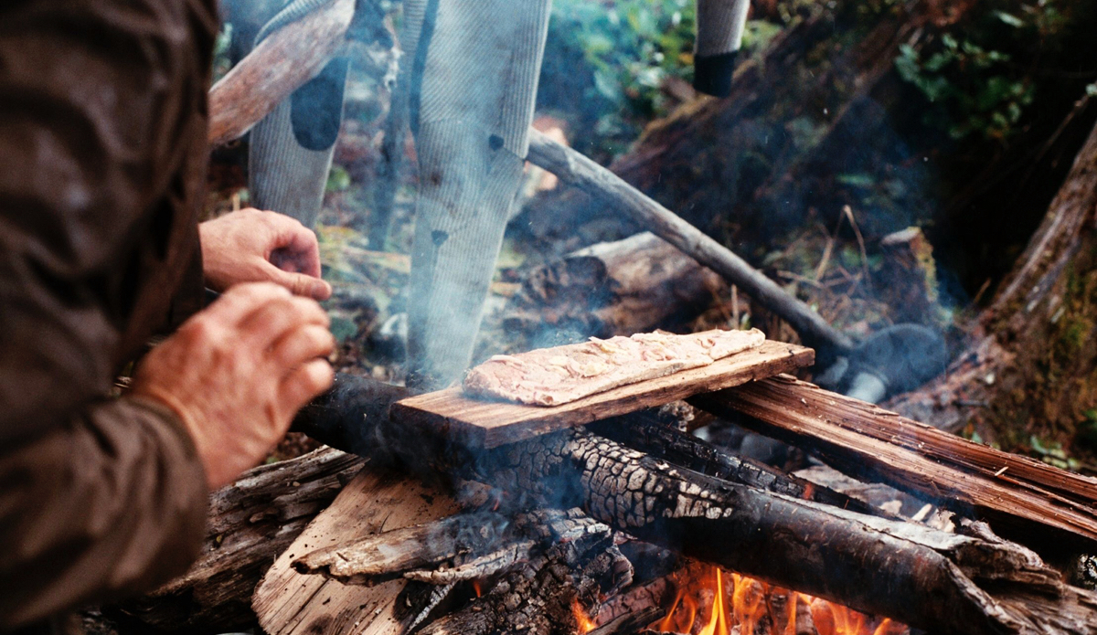 Dan Malloy barbeques some Coho salmon on the beach in British Columbia during a boat trip on the Great Bear Rainforest. Photo: <a href=\"http://trevorgordonarts.com\">TrevorGordonArts.com</a>